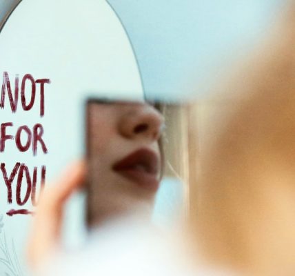 Artistic photo featuring a mirror reflection with 'Not for You' message, evoking mood and introspection.